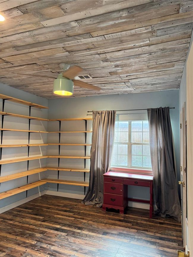 3rd bedroom is being used as an office. Wood ceiling | Image 19