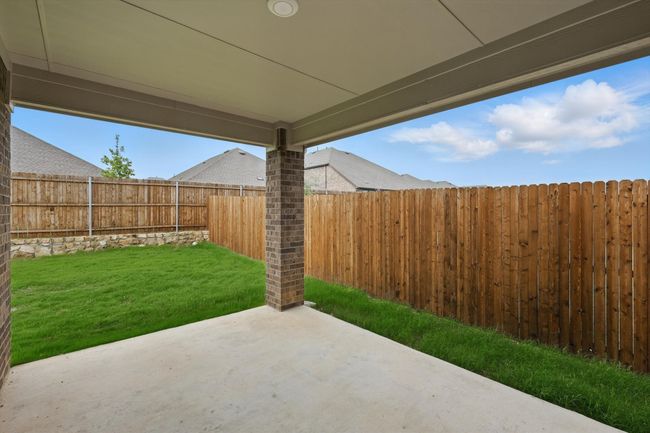 Fenced backyard featuring a patio area | Image 27