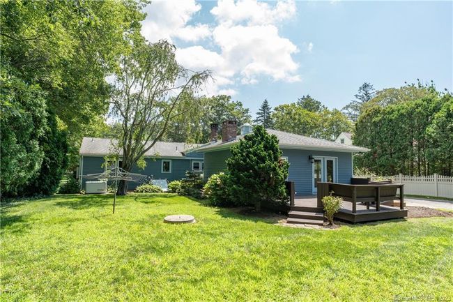 A view of the back of the house. Notice the Generac whole house generator at the left side of the back of the house. | Image 24