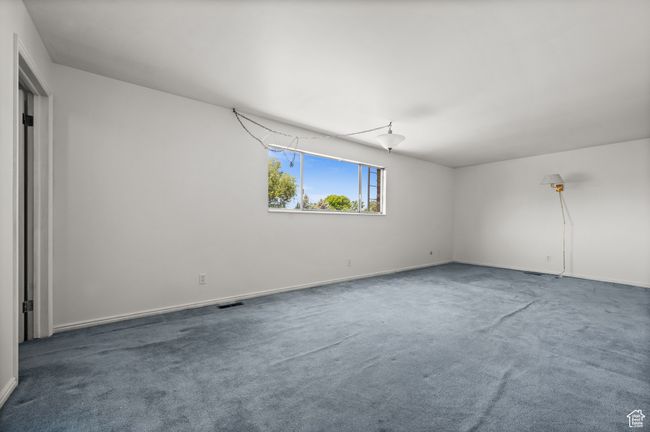 Carpeted spare room featuring baseboards | Image 19