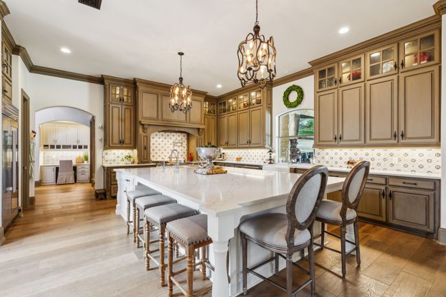 An Exquisite Kitchen Designed for Culinary Excellence with an Oversized Quartz Island | Image 10