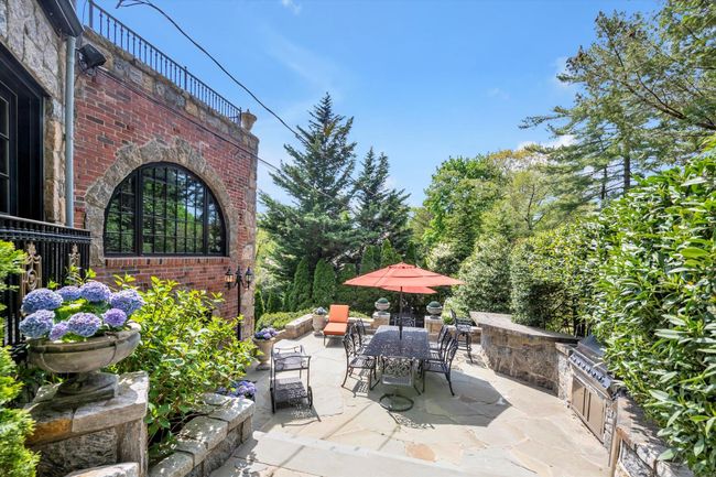 View of patio with outdoor dining space | Image 25