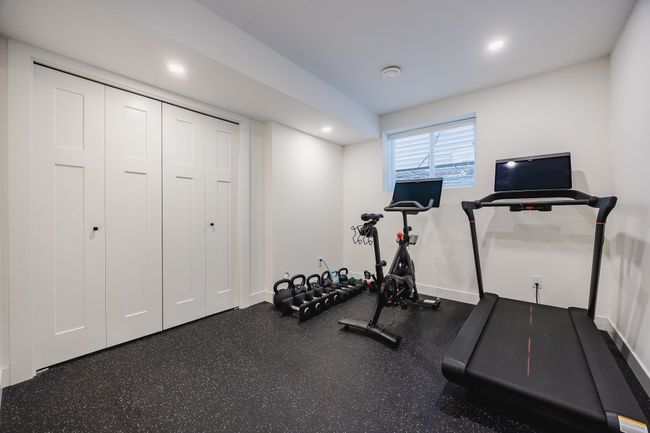Exercise area featuring baseboards and recessed lighting | Image 32
