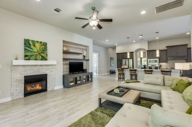 Living area with gas fireplace and sliding doors | Image 19