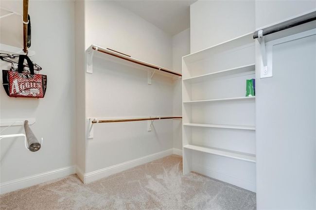 Large walk-in closet with plenty of built-in storage. | Image 15