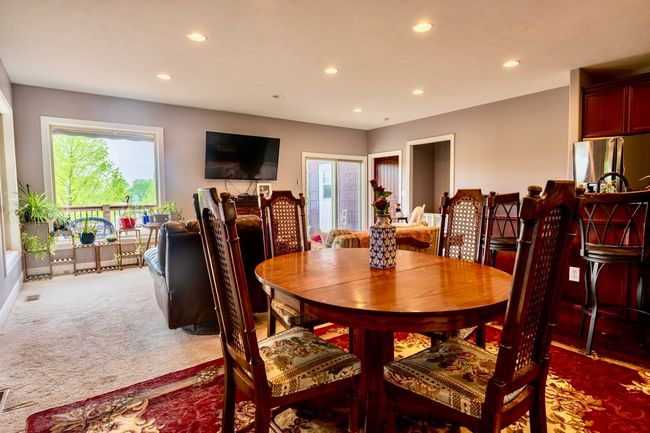 Carpeted dining room featuring recessed lighting | Image 8