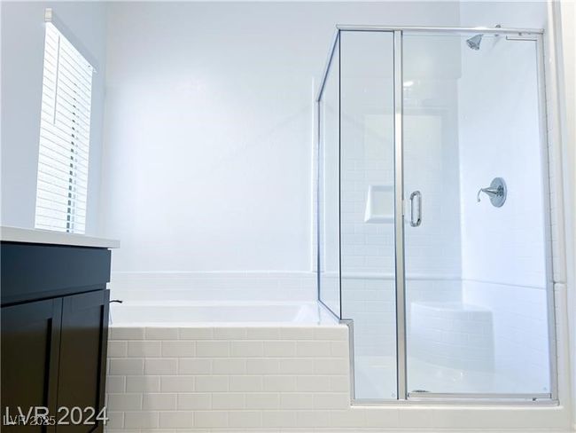 Full bath with vanity, a stall shower, and a separate shower and garden tub | Image 14