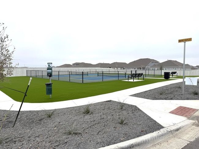 View of property's community with a tennis court and a residential view | Image 16