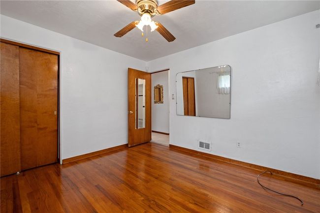 Plenty Of Space And Hardwood Floors In The Primary Bedroom | Image 10
