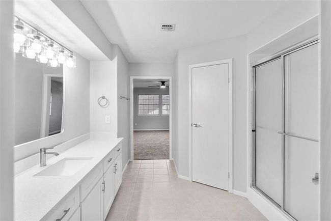 The primary bath includes both a large shower and walk-in closet. | Image 18