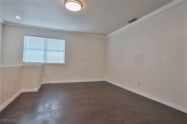 Spare room with ornamental molding, baseboards, dark wood finished floors, and recessed lighting | Image 17