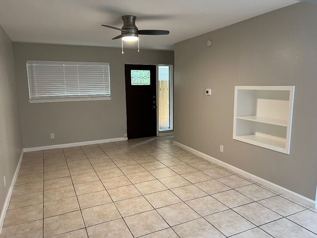 Entryway with baseboards, a ceiling fan, and light tile patterned flooring | Image 13