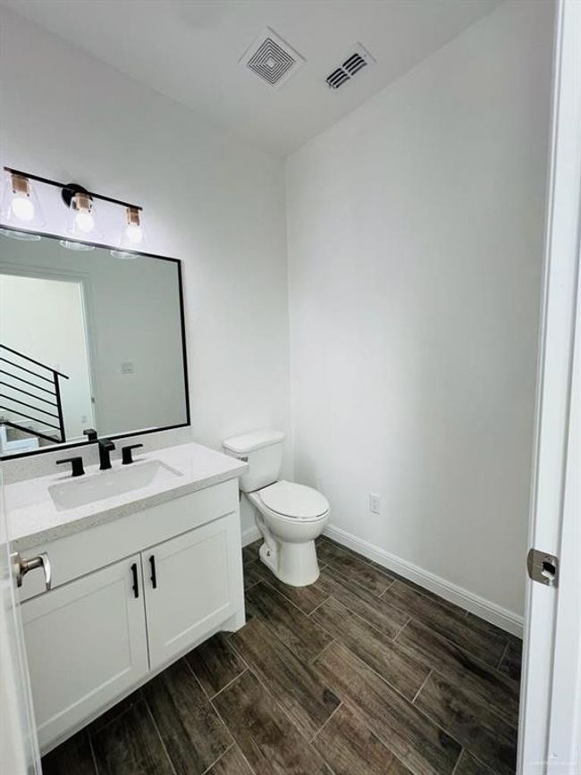 Bathroom with vanity and toilet | Image 10