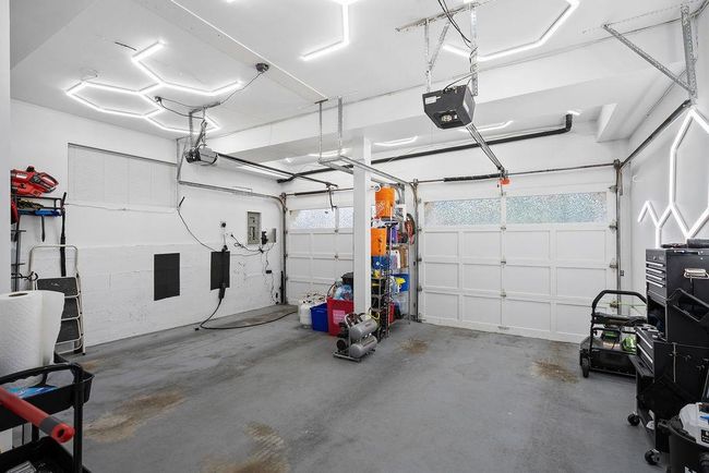 Garage with a garage door opener | Image 38