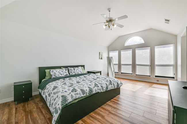 Bedroom featuring ceiling fan, vaulted ceiling, and hardwood / wood-style floors | Image 15