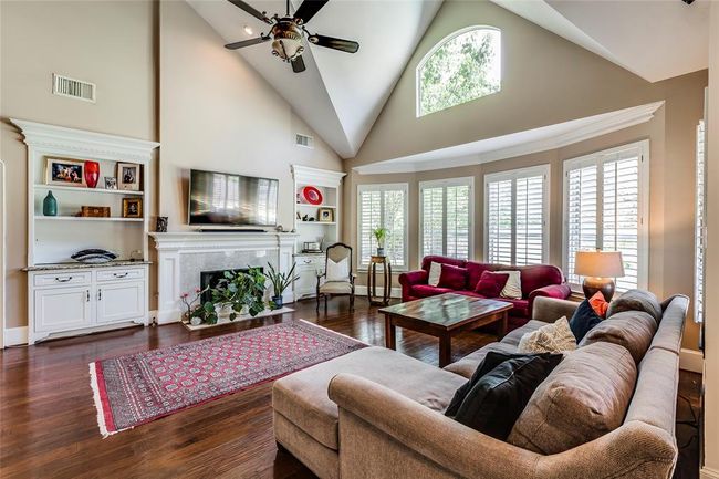 Large Living room with beautiful custom built ins with granite tops, lots of natural light | Image 11