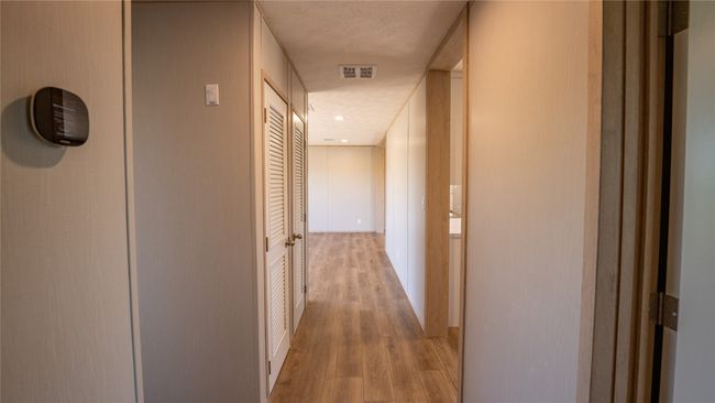 Hall featuring light wood-type flooring | Image 26