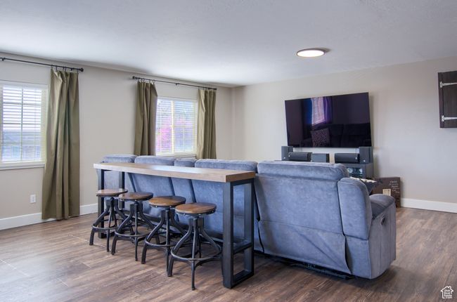 Great/Family Room with baseboards, dark wood-style floors, and plenty of natural light | Image 36