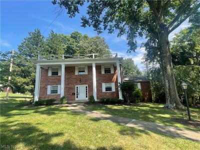 Greek revival house featuring a front yard | Image 1