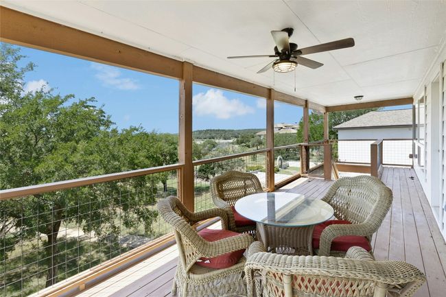 Covered patio with lake views for perfect al fresco dining | Image 17