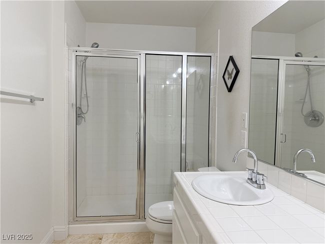 Full bath with vanity, toilet, tile patterned flooring, and a stall shower | Image 37