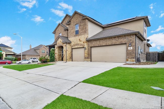 A stunning exterior shot of the home set against a | Image 5
