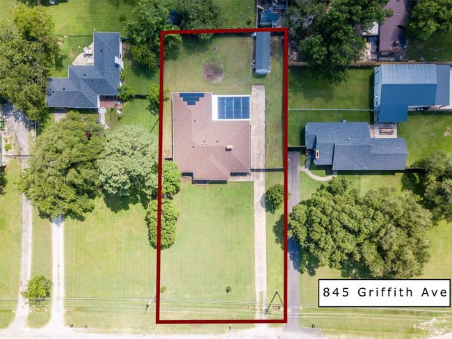 Aerial view that provides 'approximate border' of this property. FYI...solar panels are being removed. | Image 33