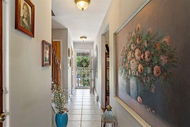 Hall featuring light tile patterned floors | Image 8