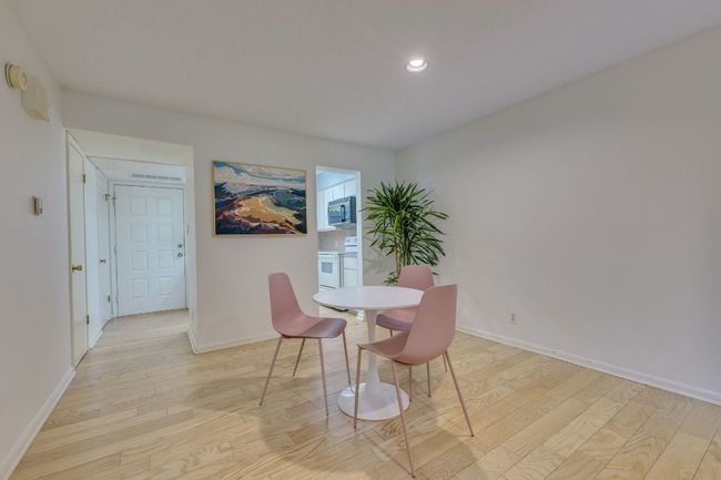 Dining room featuring light wood-type flooring, baseboards, and recessed lighting | Image 12
