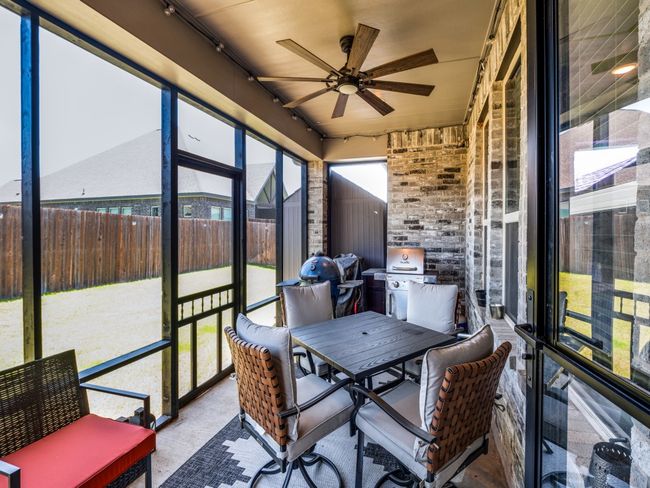 Sunroom / solarium featuring ceiling fan and outdoor dining space | Image 33