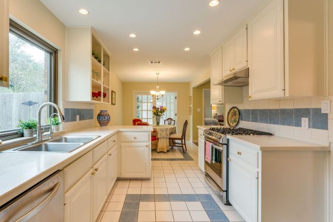 Kitchen opens to breakfast dining area | Image 8