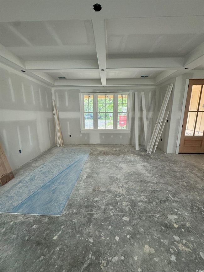 Unfurnished living room featuring coffered ceiling | Image 24