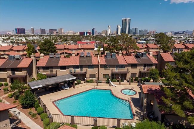 Community pool with a hot tub and a skyline view | Image 14
