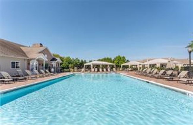 Community pool with a patio | Image 30
