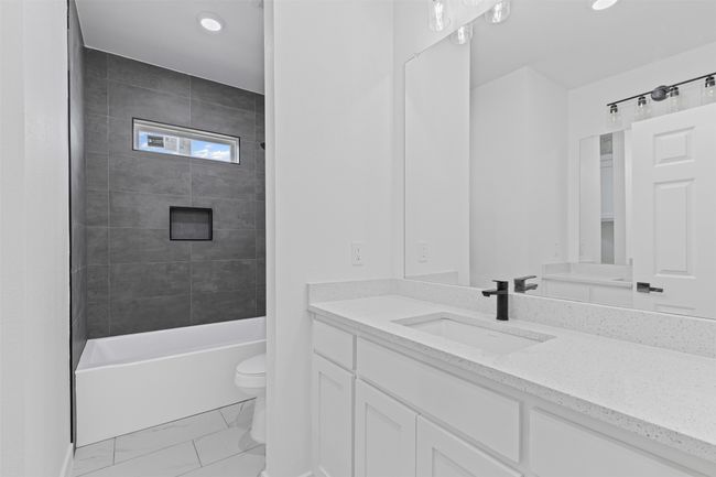Bathroom with recessed lighting, marble finish floor, toilet, and vanity | Image 32