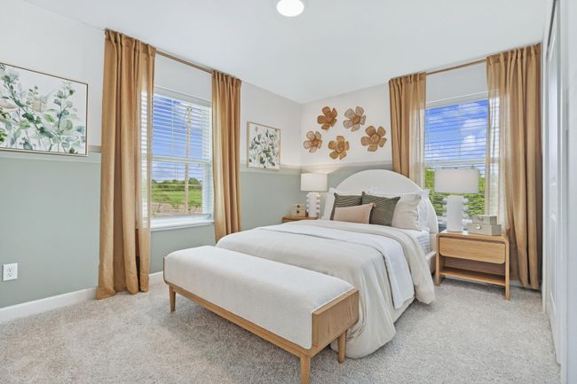 (Photo of model home, features will vary) The larger of the two secondary bedrooms, this retreat is ideal for residents who require more personal space and privacy. | Image 13