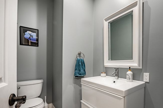 Bathroom featuring toilet and vanity | Image 25