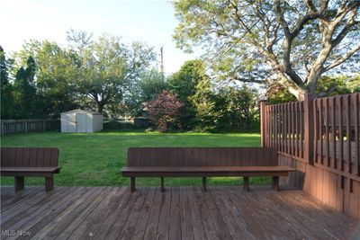 Deck with a storage unit and a yard | Image 3