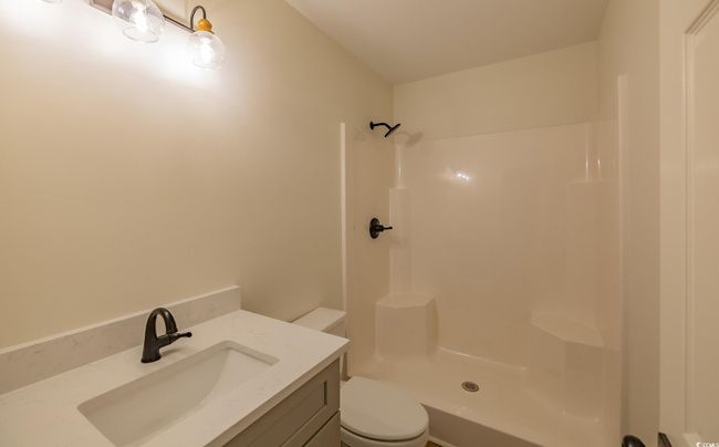 Bathroom with vanity and a shower | Image 33