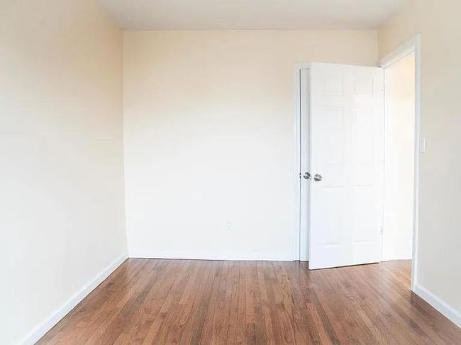 Empty room featuring wood finished floors and baseboards | Image 10