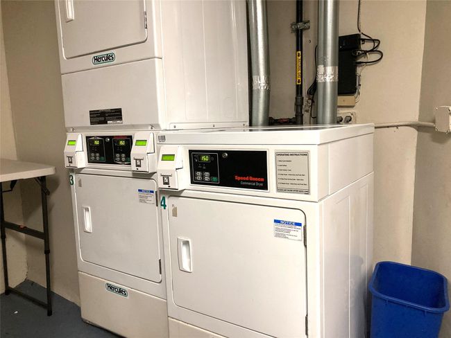 Shared laundry with stacked washer / dryer and washer and clothes dryer | Image 22