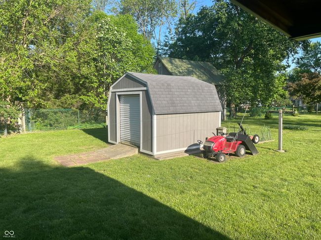 Nice 12x12 shed with ramp for storage and a large door for lawn equipment | Image 32