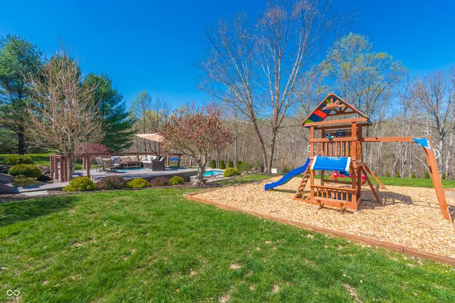view of play area featuring a yard and an outdoor hangout area | Image 31