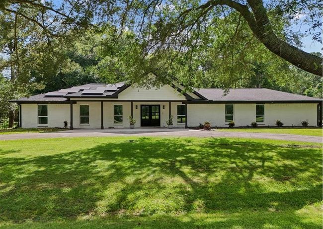 It doesn't get much better than this Beautiful ranch-style exterior framed by mature trees and lush greenery. | Image 12