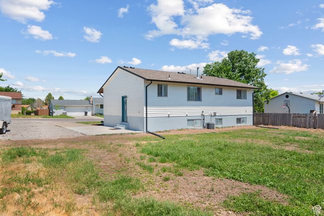 Back of house with roof with shingles | Image 17