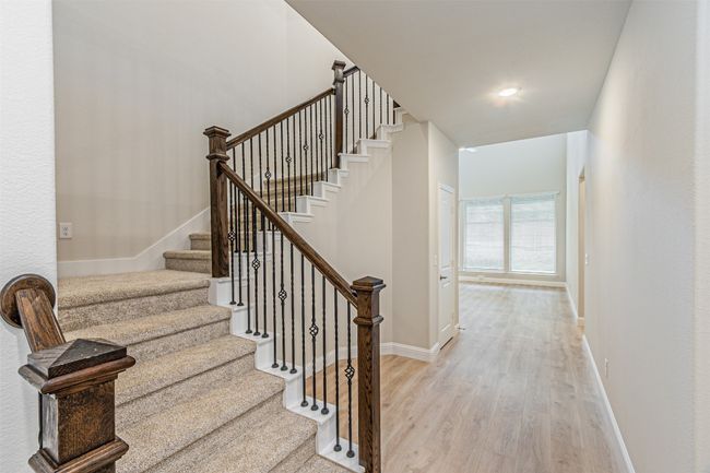 Staircase with wood finished floors and baseboards | Image 9