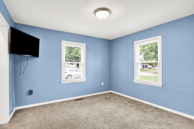 carpeted spare room featuring healthy amount of natural light and baseboards | Image 17