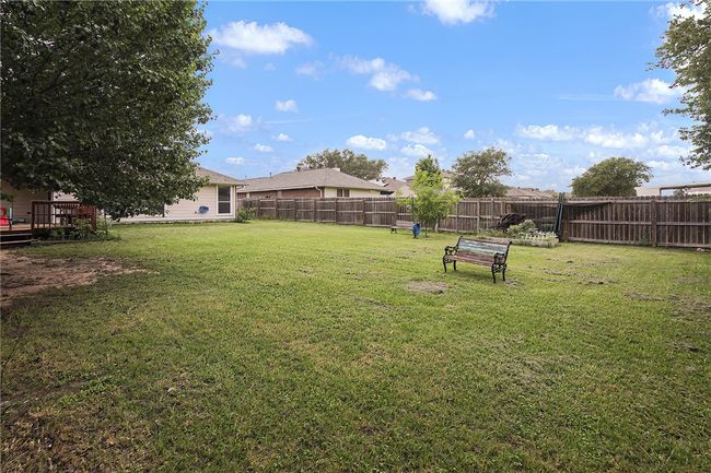 View of yard featuring a deck | Image 25