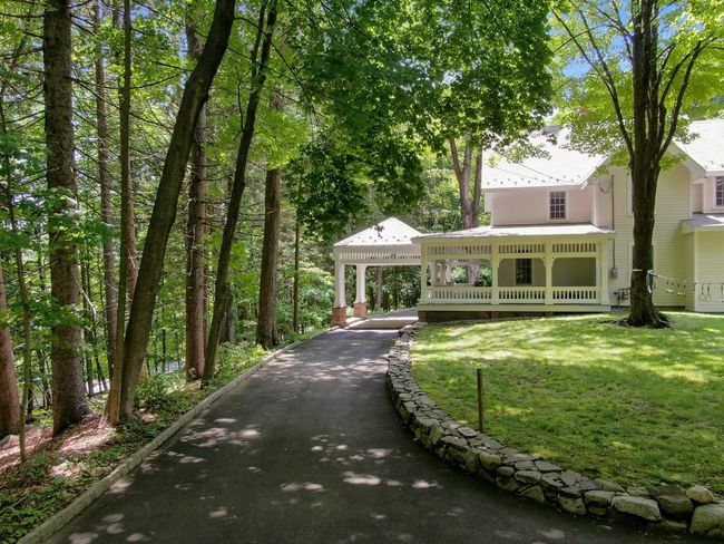 View of front of house with a front lawn and metal roof | Image 40