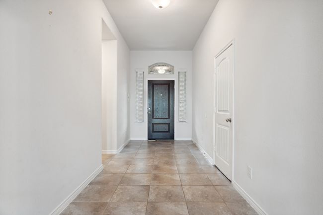 Doorway to outside with baseboards | Image 7